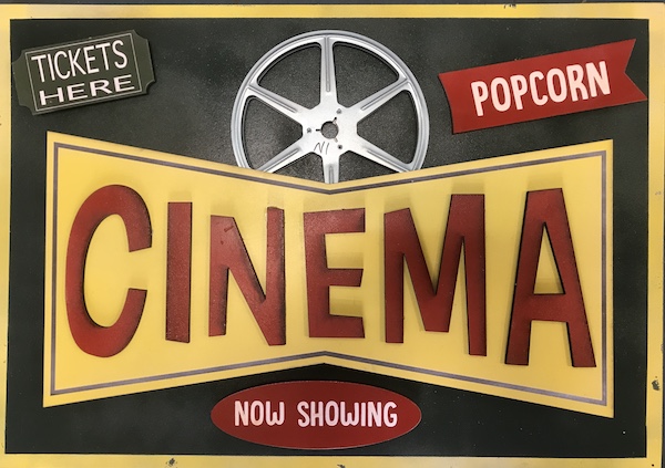 Layered home theater sign